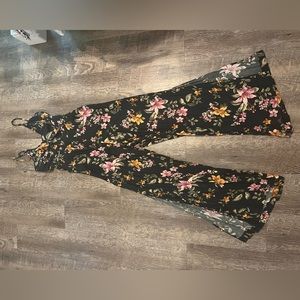 American eagle jumpsuit. Black with purple and yellow flowers.